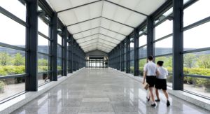 Two Girls at School Walking Underneath an Aluminum Walkway Cover